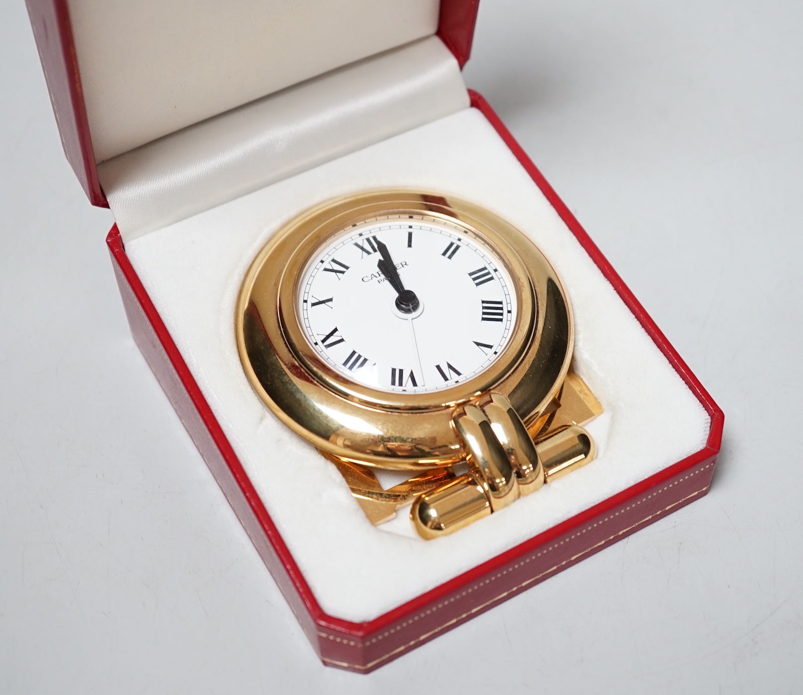 A Cartier travel timepiece, 9cm high, cased